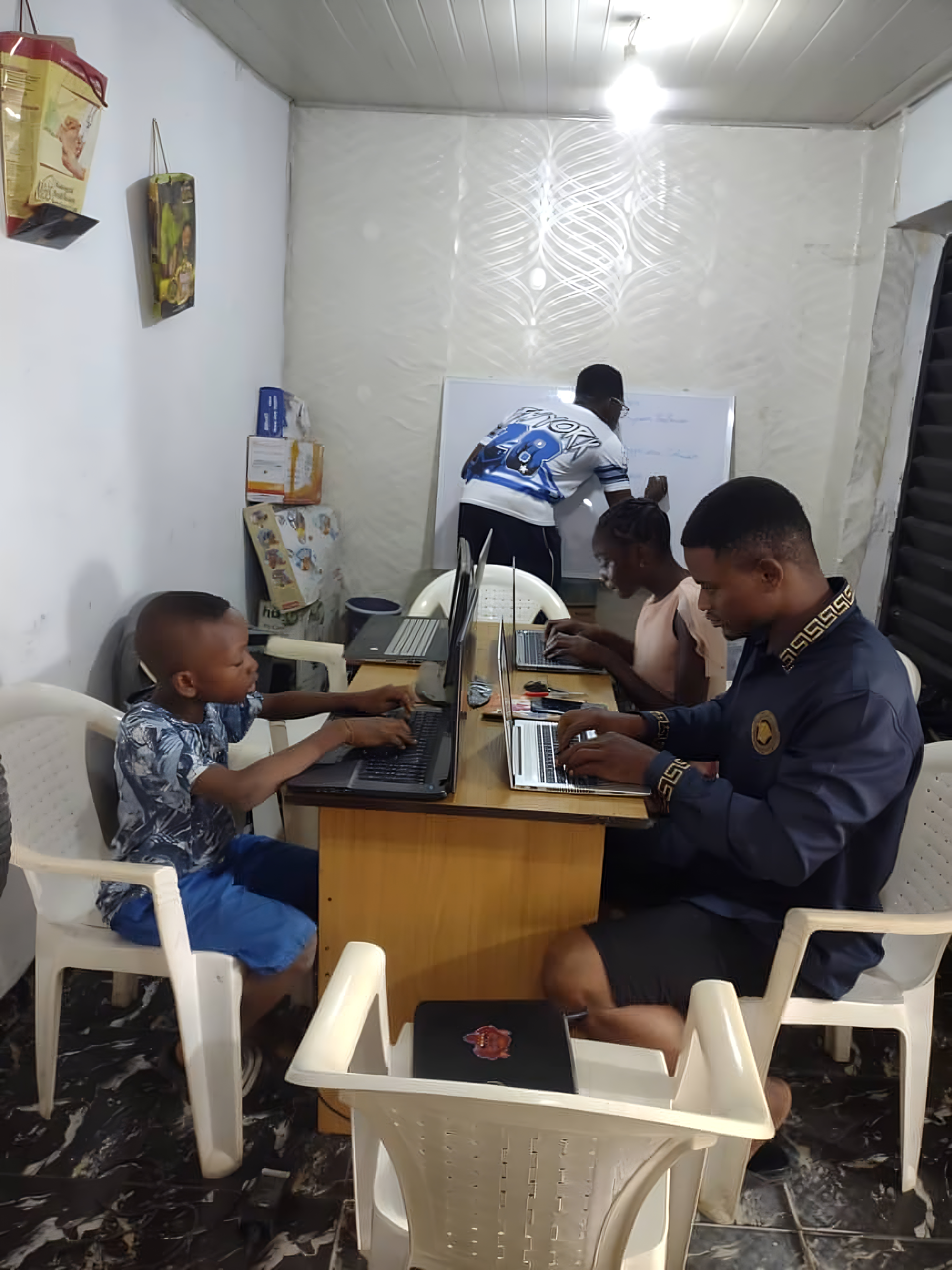 Smiling child learning with a laptop